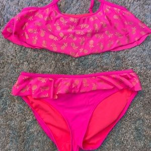 pink bathing suit with pineapples on it. Size 16(kids)